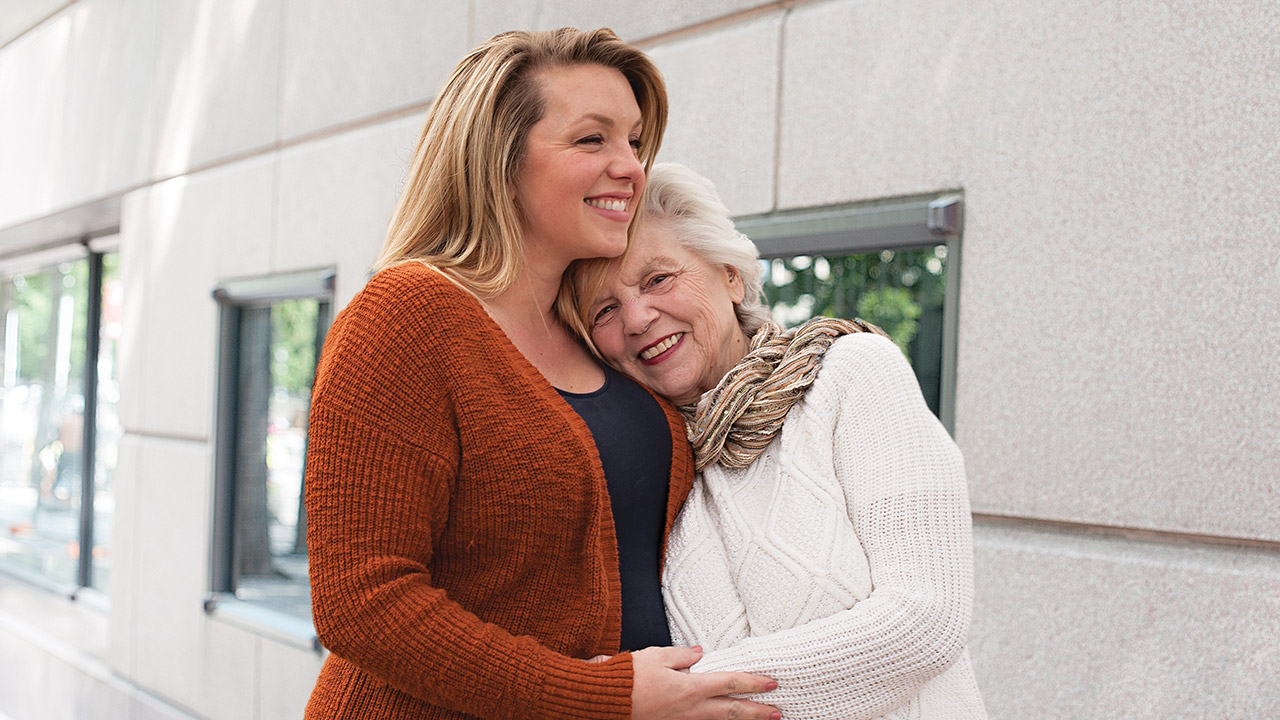Woman hugging her grandmother Woman hugging her grandmother